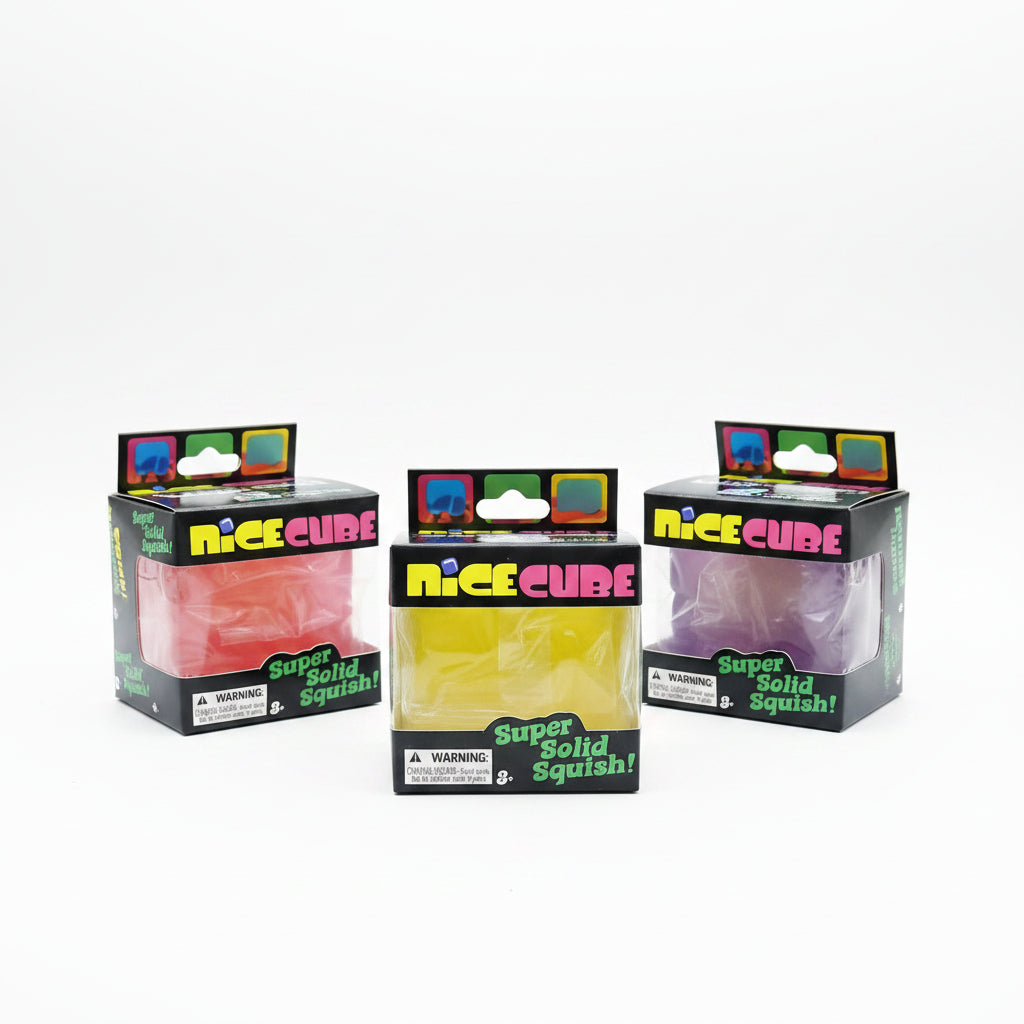 Three NeeDoh Nice Cube squish toys in red, yellow and purple displayed in their retail boxes
