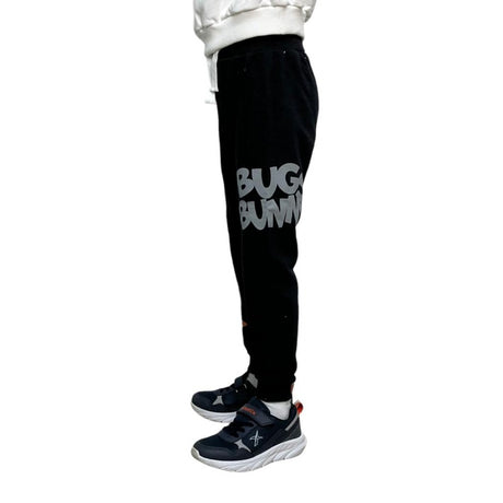 Back view of black kids joggers with a cartoon rabbit holding a basketball on the calf