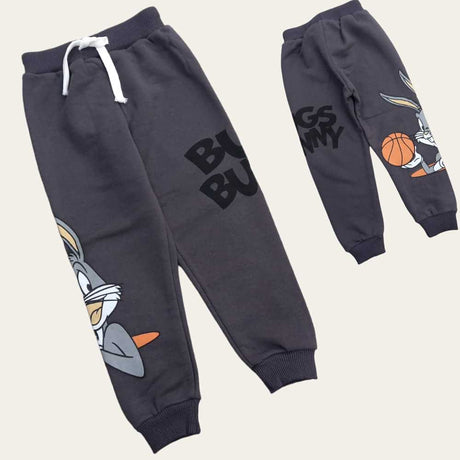 Flat lay of dark grey cartoon rabbit joggers with a white drawstring waist and ribbed ankles