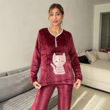 Burgundy pyjama top shown from the front with the cat applique at the waist