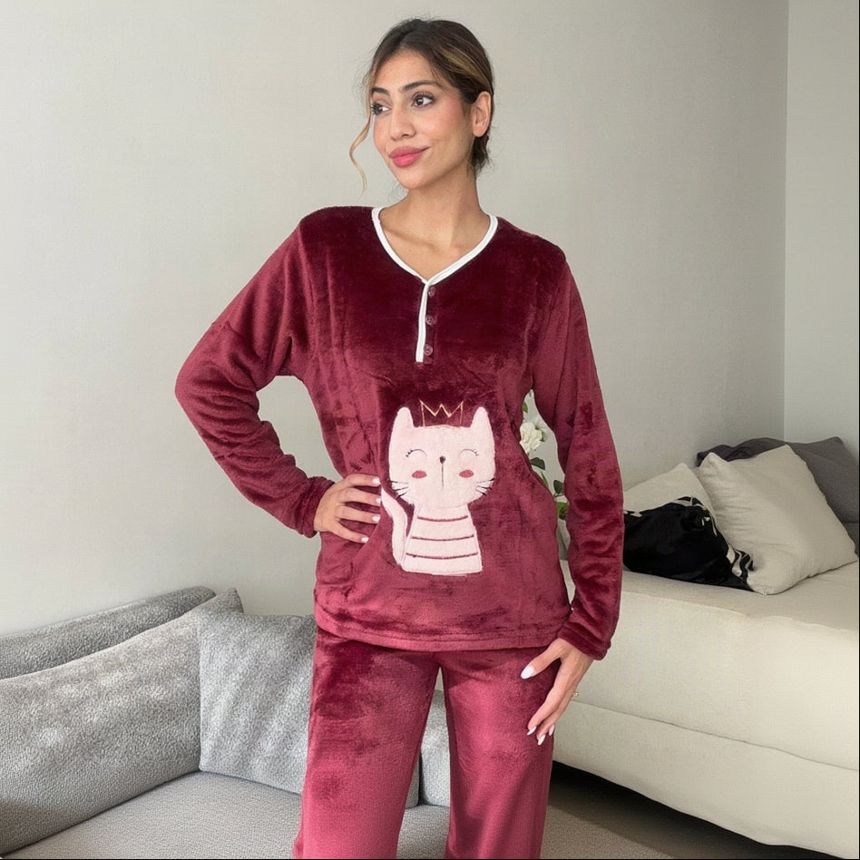 Burgundy fleece pyjama set worn with hands on the hips showing the relaxed cut