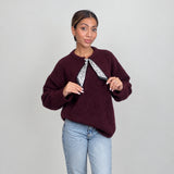 Burgundy wool knit top with a printed neck scarf tie, held at the ends