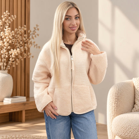 Woman in a burgundy sherpa zip jacket with a stand collar and two lower pockets