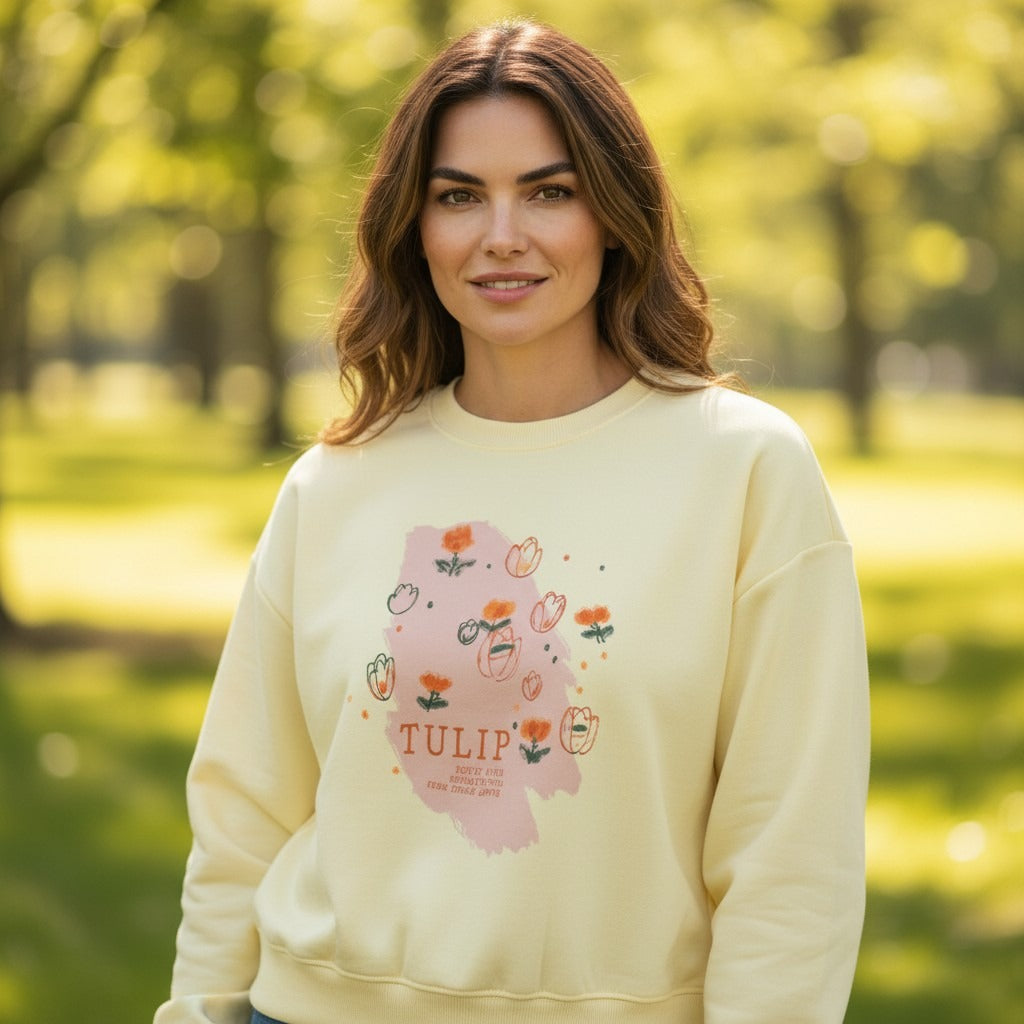 Woman in butter yellow sweatshirt with a hand drawn tulip print, Jack Gifts Online Lebanon