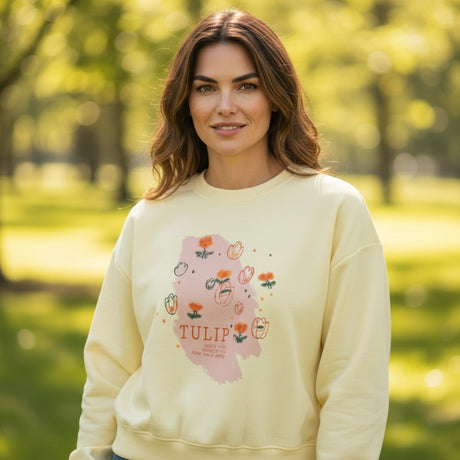 Woman in butter yellow sweatshirt with a hand drawn tulip print, Jack Gifts Online Lebanon