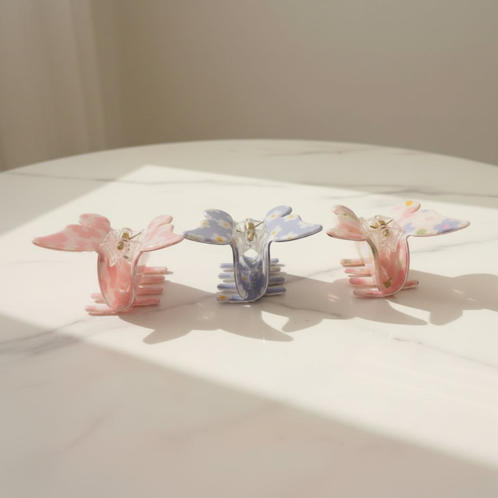 Butterfly claw clips in pink, cornflower blue, and white, with floral pastel prints