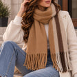Camel blanket scarf with cream and dark brown edge stripes and long tassels
