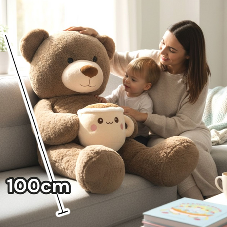 Brown bear with cream ear panels and a wide cream muzzle, its latte mug plush at rest in its lap