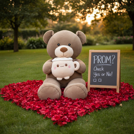 Mocha teddy bear seated outdoors with the latte mug plush in both arms