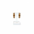 Caramel and cream harlequin enamel hoop earring detail