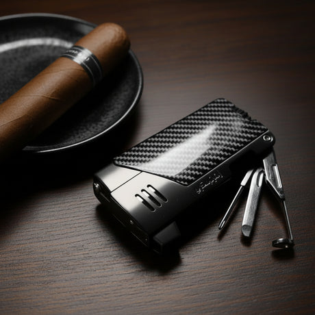 Carbon fiber lighter with tools on a wooden surface next to a cigar