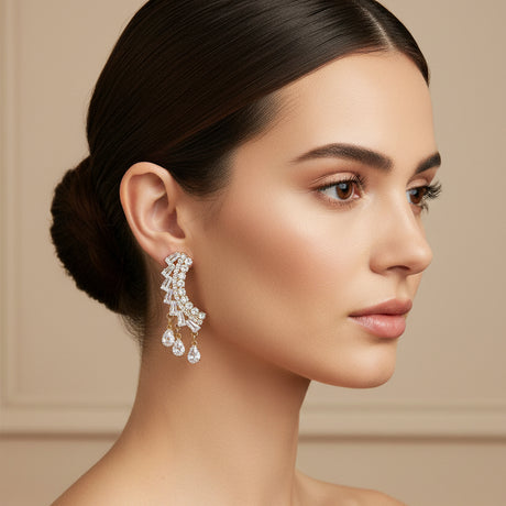 Woman wearing a cascade drop earring on a beige background