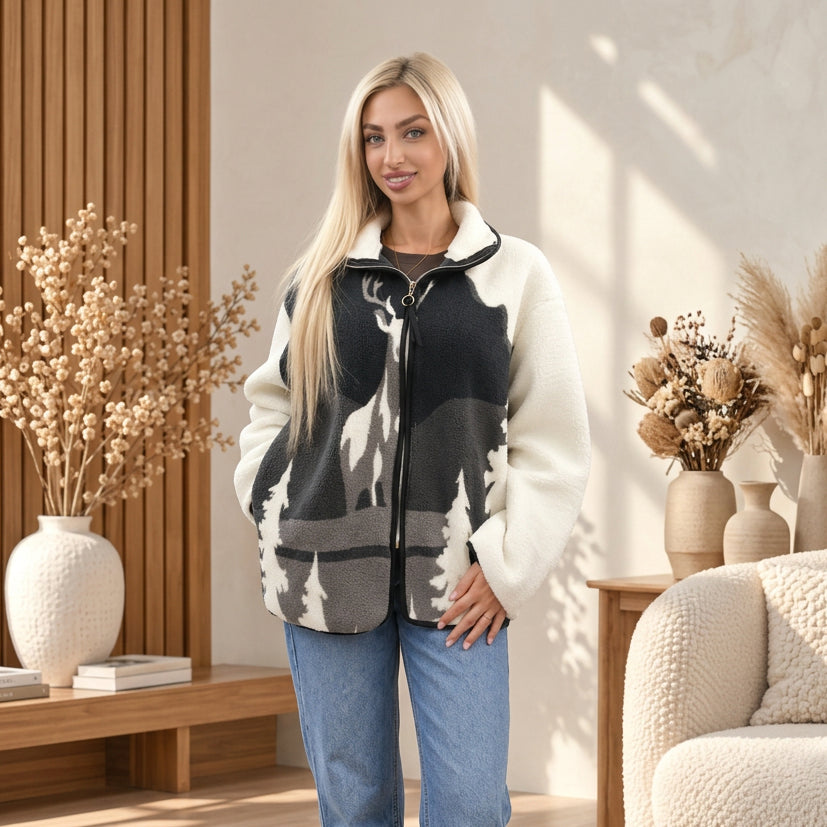Woman in a charcoal and grey sherpa zip jacket with a stag silhouette, pine trees and cream sleeves