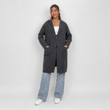 Charcoal hooded toggle cardigan worn open over a white crop top and jeans