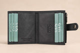 Charcoal nubuck interior lined with teal cards, the snap tab resting on the right edge