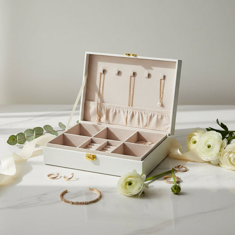 Cream jewelry box open to show five necklace hooks, an elastic pouch and ring slots
