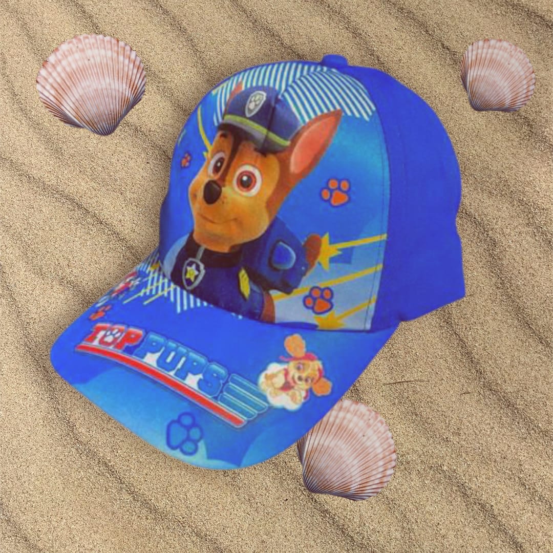 Royal blue police pup cap angled on sand, brim reading Top Pups