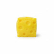 Yellow swiss cheese squishy stress toy with holes on a white background