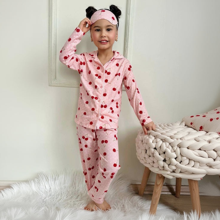 Girls pink cherry print pajama set with button up top, pants and eye mask