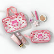 Set of pink cherry pouches with cosmetic products on a white background