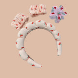 Cherry print spa headband set with two wrist bands and a floral claw clip