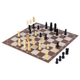 Chess board mid game with captured cream and black pieces set to one side