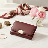 Women's mini wallet with a gold clasp detail
