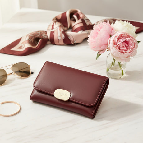 Women's mini wallet with a gold clasp detail
