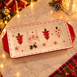 Rectangular white ceramic serving tray with red handles and raised red Christmas trees