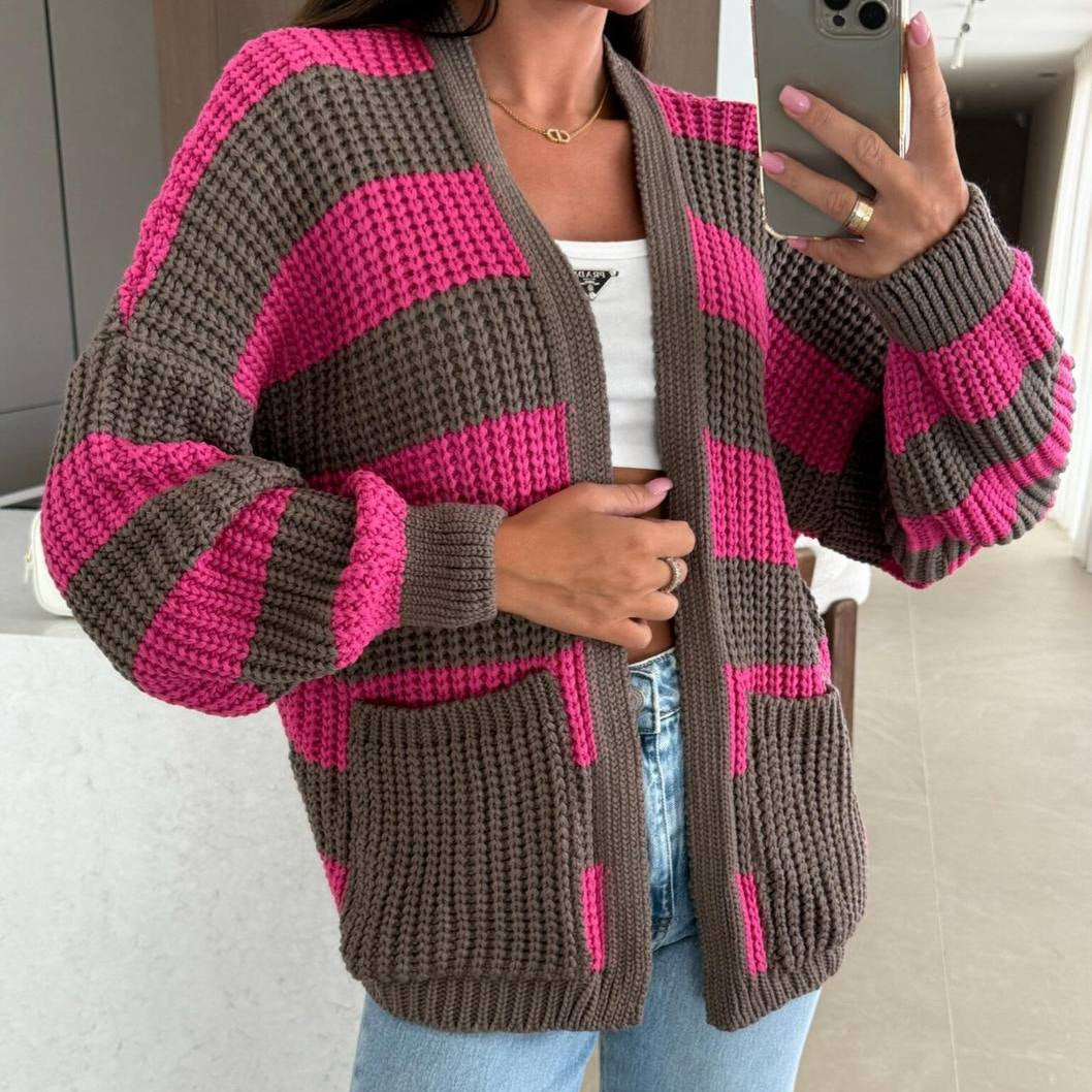 Close view of the chunky rib stitch and wide fuchsia stripes on the sleeves