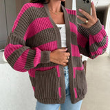 Close view of the chunky rib stitch and wide fuchsia stripes on the sleeves