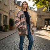 Pink and taupe striped knit cardigan with long balloon sleeves, outdoor street style