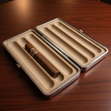 Open cigar case with a single cigar on a wooden surface