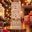 Cinnamon spice reed diffuser in a cream gift box printed with gnomes, snowmen and reindeer
