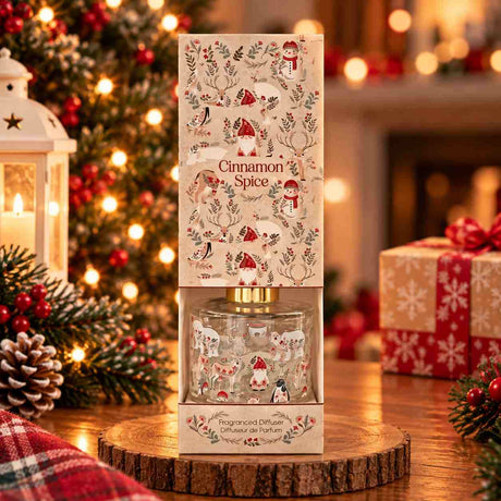 Cinnamon spice reed diffuser in a cream gift box printed with gnomes, snowmen and reindeer