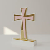 Flared acrylic cross in pale pink with a gold mirrored cross running down its shaft
