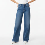 Blue jeans worn by a person on a white background