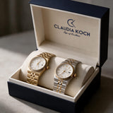 Gold and two tone fluted bezel ladies watches side by side in an open gift box
