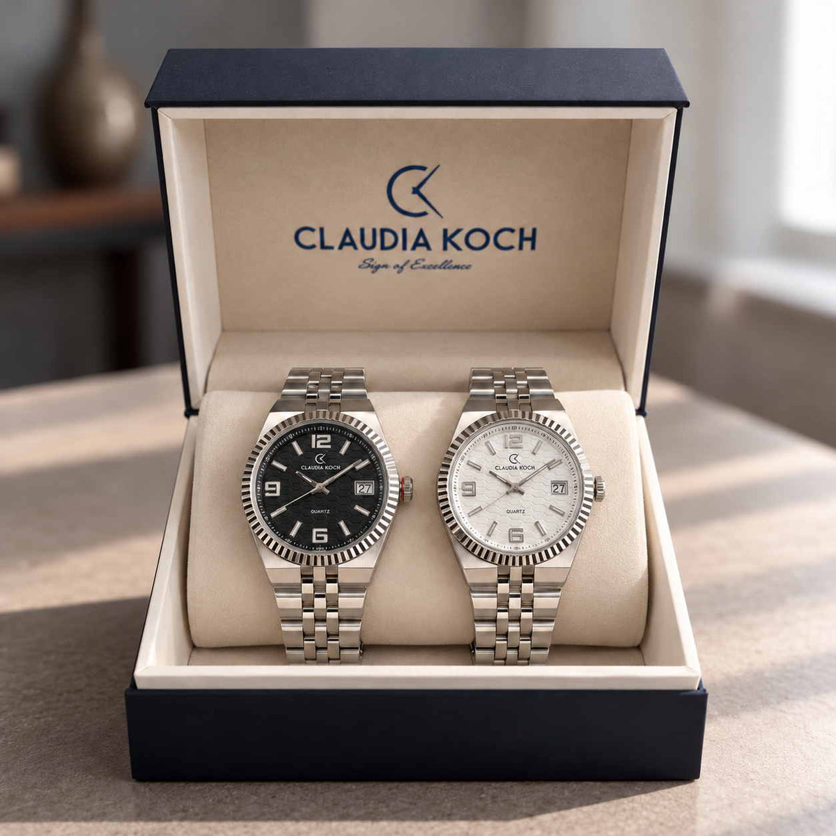 Black dial and white dial fluted bezel steel men's watches in an open gift box