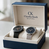 Black and silver mesh strap men's watches with date windows in an open gift box