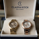 Gold and rose gold multi dial ladies watches displayed in an open gift box