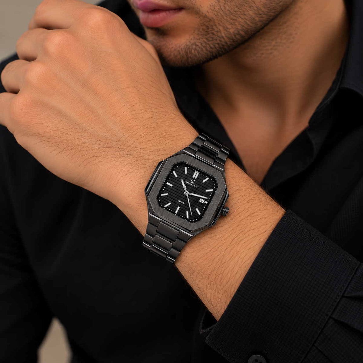 Gunmetal octagon watch with ribbed dial worn with a black shirt