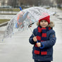 Boy holding a clear see through Spiderman kids umbrella with a red and black web print