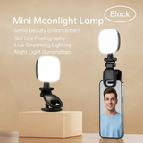 Clip on selfie light shown on its stand and attached to a phone for video calls