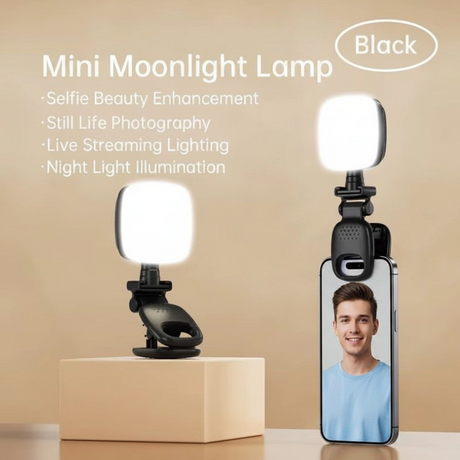 Clip on selfie light shown on its stand and attached to a phone for video calls
