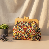 Zigzag pattern handmade bag next to a succulent pot and a lavender sprig