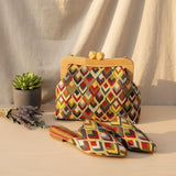 Colourful zigzag frame bag shown with matching pointed toe mules