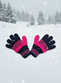 Black and hot pink striped kids gloves in a snowy forest