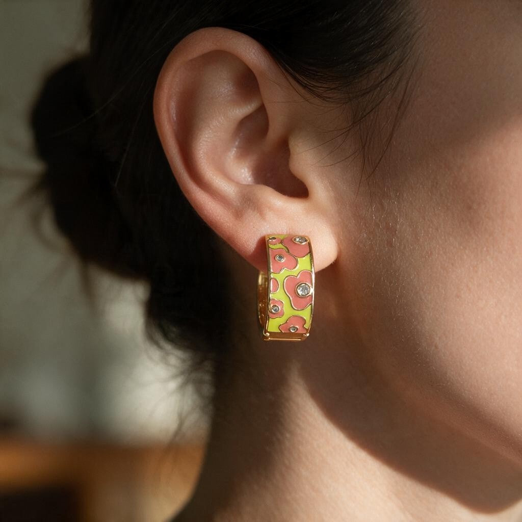 Coral and lime flower enamel huggie hoop earring with tiny crystals worn on the ear