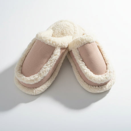Empty pair on a white studio background, suede look upper wrapped in thick cream teddy trim